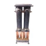 A Victorian cast iron and copper two column gas radiator, raised on ball and claw feet, 95cm high,