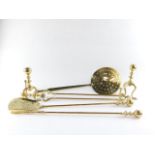 A Victorian brass fireside set, comprising a poker, shovel and pair of coal tongs, together with a