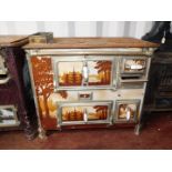 A French early 20thC cast iron and enamel kitchen range, Loussert St Etienne, the front and doors