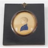 English School (Early 19thC). Miniature half length portrait of a boy, facing left, in a blue