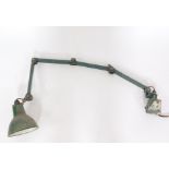 An EDL green vintage industrialist machinist's lamp, wall mounted, with five angular function.