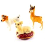 A Beswick Babycham deer, Jack Russell Terrier, and a figure of a Chihuahua, modelled lying on a