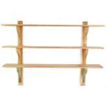 A set of three Victorian pine scullery shelves, with shaped end supports, 138cm high, 199cm wide.