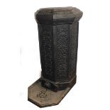 A late 19thC cast iron patio heater, of octagonal form, the pierced sides with floral and foliate