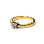 An 18ct gold and diamond four stone ring, set with princess cut diamonds in a square claw setting,