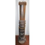 A Jernstoberi of Frederiksberg late 19thC cast iron wood burning stove, of cylindrical form, with