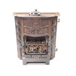 A Callon Bilston cast iron gas fire, of serpentine form, cast with Art Nouveau floral motifs, acorns