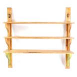 A set of three Victorian pine scullery shelves, with shaped end supports, 149cm high, 158cm wide.