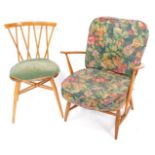 An Ercol beech and elm low Windsor armchair, with loose floral cushion seats, together with an Ercol