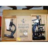A Signalling Equipment Ltd student's microscope, boxed, and a Stein student's microscope, also