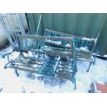 A near pair of cast iron garden benches, with scroll arms and wooden slats. (AF)