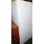 An Indesit MC06 upright fridge, model no SIAA12, 175cm high.