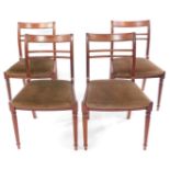 A set of four reproduction mahogany dining chairs.The upholstery in this lot does not comply with