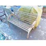 A mid 20thC cast metal garden bench, with curved arms and wooden slats.