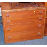 A Stag teak chest of four drawers, with oven knob style handles, 69cm high, 77cm wide, 43cm deep.