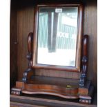 A Victorian mahogany toilet mirror, with scroll supports above a serpentine base, 53cm high, 44cm