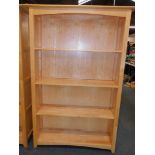 A beech bookcase, enclosing three fixed shelves, 151cm high, 101cm wide, 34cm deep.