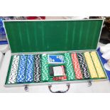 A cased gaming set, containing counters, playing cards and dice.
