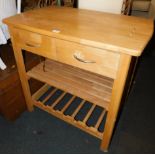 A beech kitchen unit with two drawers, under shelf and a bottle rack, 81cm high, 84cm wide, 54cm