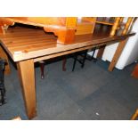 A pine rectangular kitchen table, raised on square legs, 75cm high, 180cm wide, 101cm deep.