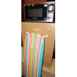 A Morphy Richards 800w stainless steel microwave, model no P80H20P-YU, together with an ironing