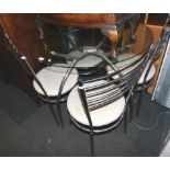 A chrome and glass topped breakfast table, 76cm high, 91cm diameter, together with four matching