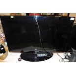 A Samsung 32" colour television, model LE32B450C4W, with remote. (AF)