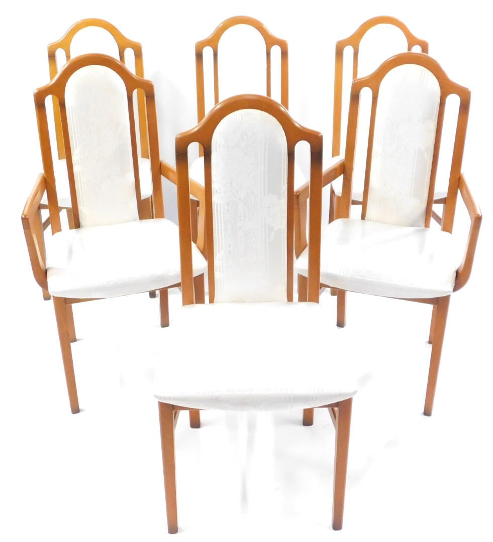 A set of six Caxton beech dining chairs, upholstered in cream floral damask, including two carvers.