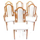 A set of six Caxton beech dining chairs, upholstered in cream floral damask, including two carvers.