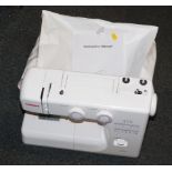 A Janome electric sewing machine, model 2090, with protective bag and instructions.Trade Only -