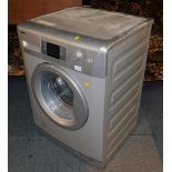 A BEKO 7kg Excellence washing machine, in silver, model WMB714425.