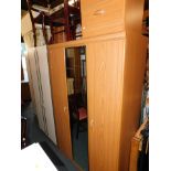An Alstons teak effect double wardrobe and matching bedside chest, 184cm high, 115cm wide, 52cm deep