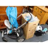 A Quinny child's buggy, Dreami Buzz carry cot, and three Maxi - Cozi child seat frames, with one