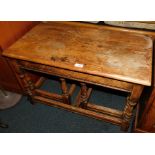 An Old Charm style oak nest of tables, 48cm high, 76cm wide, 41cm deep. (AF)