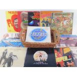 A basket containing LP records, including Bill Haley and the Comets, The Rolling Stones, Little