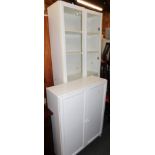 A white melamine glazed two door bookcase, 203cm high, 81cm wide, 31cm deep, together with a similar