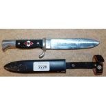 A replica Third Reich Hitler Youth dagger with sheath.