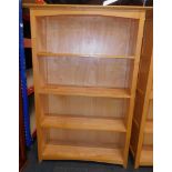 A beech bookcase, enclosing three shelves, 151cm high, 101cm wide, 34cm deep.