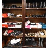 Lady's shoes, including Clarks and Hotter, boots, slippers and handbags, some boxed. (10 shelves)
