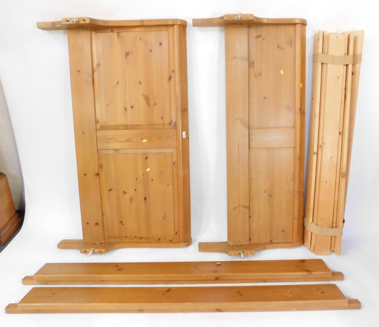 A waxed pine double sleigh bed, with deep panelled head and foot board, 90cm high,