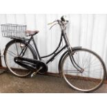 A Sturmey Archer geared vintage ladies bicycle, with a front bicycle lamp, Miller's bike bell and