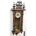 A late 19thC/early 20thC Vienna wall clock, in a walnut case, with reeded pilasters, the dial AF,