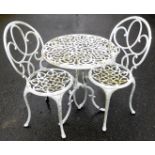 A two seater cast alloy garden bistro set, the circular seats and table with pierced decoration,