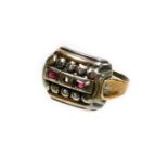 A dress ring, with rectangular ring head, set with tiny diamonds, and two baguette cut rubies, the
