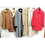 A group of ladies overcoats, to include a red overcoat, a suede and wool overcoat, a Daks short