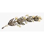 A Victorian diamond and pearl leaf brooch, the brooch formed of a leaf branch with three strand