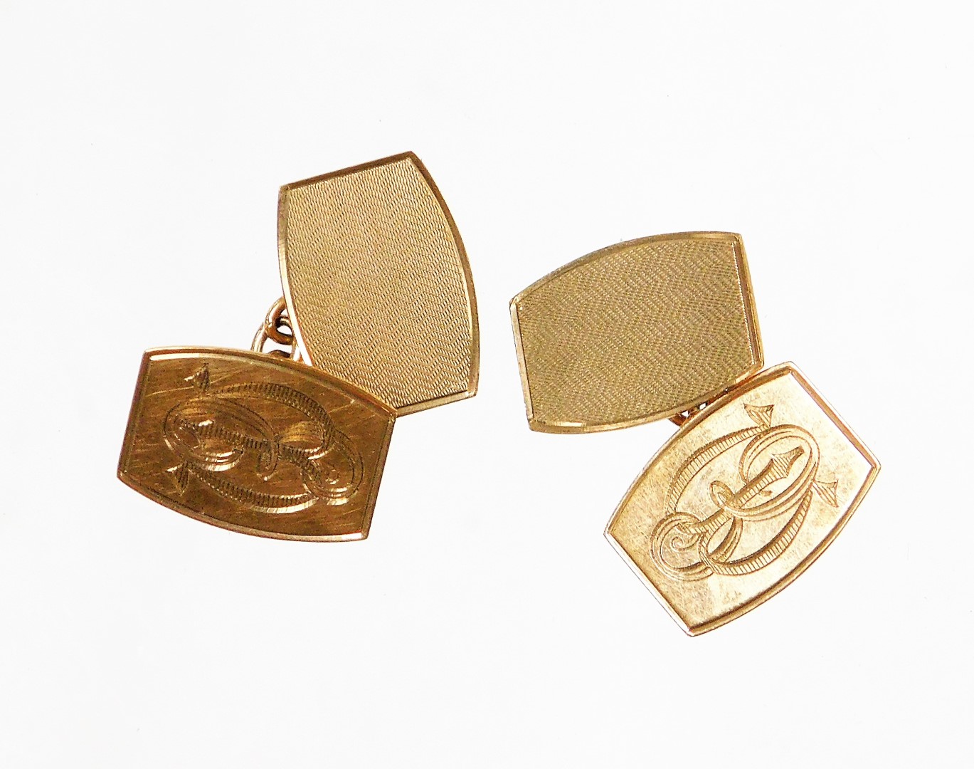 A set of 9ct gold cuff links, with engine turned decorated, the back with striped engine turn