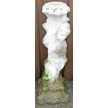 A reconstituted stone garden ornament of a boy holding a cornucopia, on a shaped base, 90cm high,