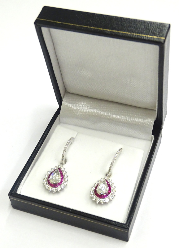 A pair of diamond and ruby drop earrings, each set with central rose cut diamond approx 1.23cts,