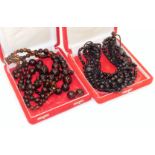 Two modern costume jewellery necklaces, to include an orange and black coloured beaded necklace,
